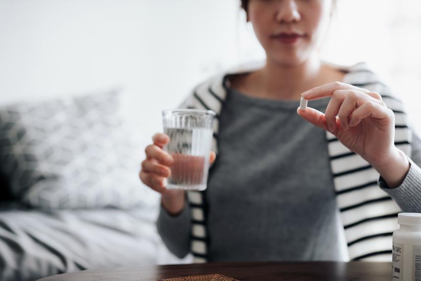 Woman taking medication