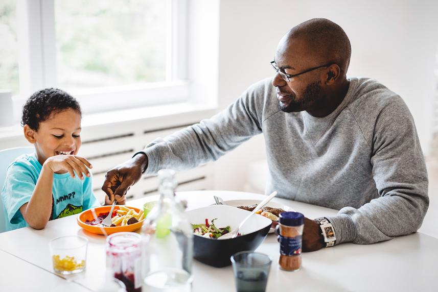 Father and son eating a meal